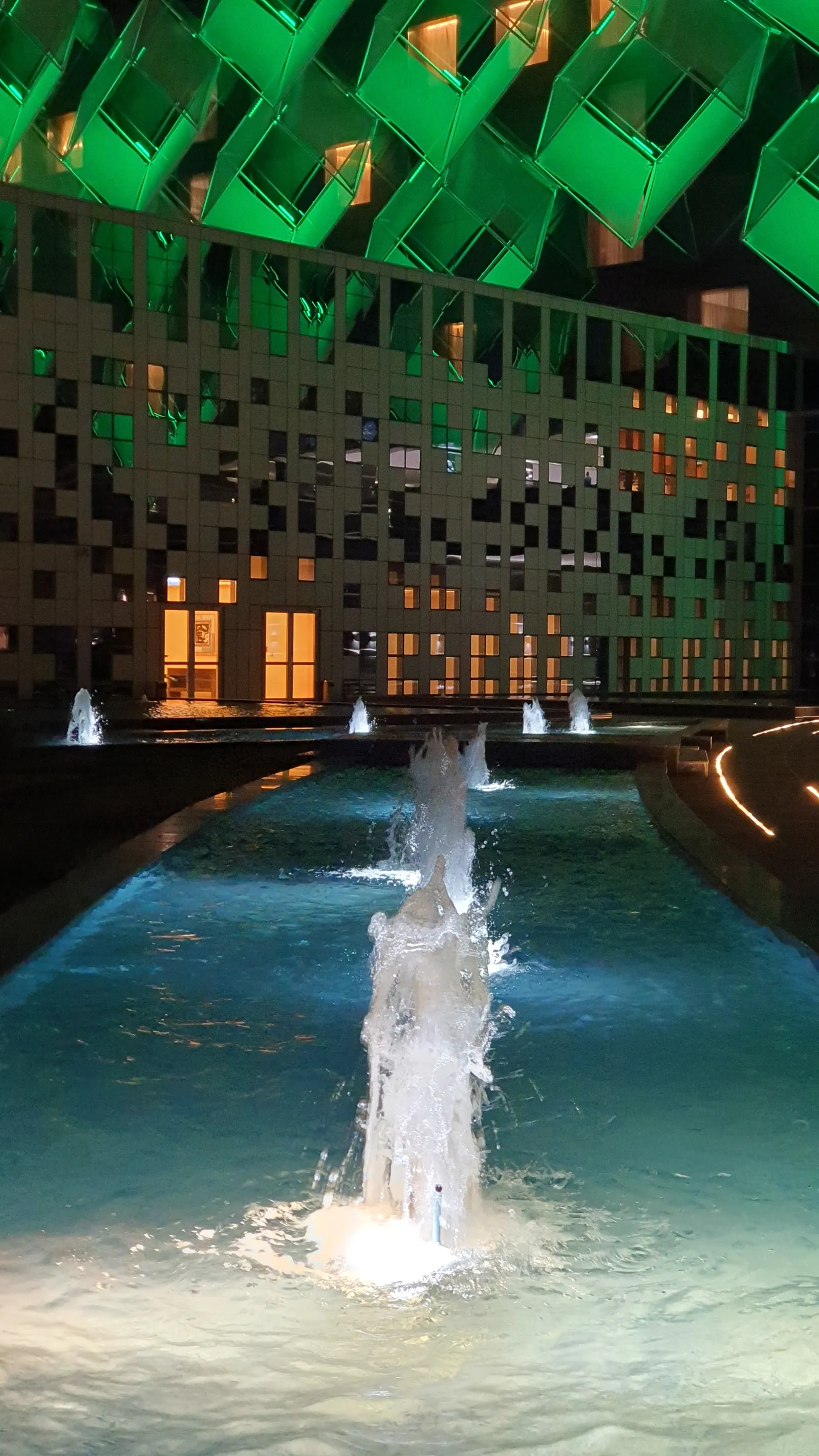 Close-up of a fountain jet at night