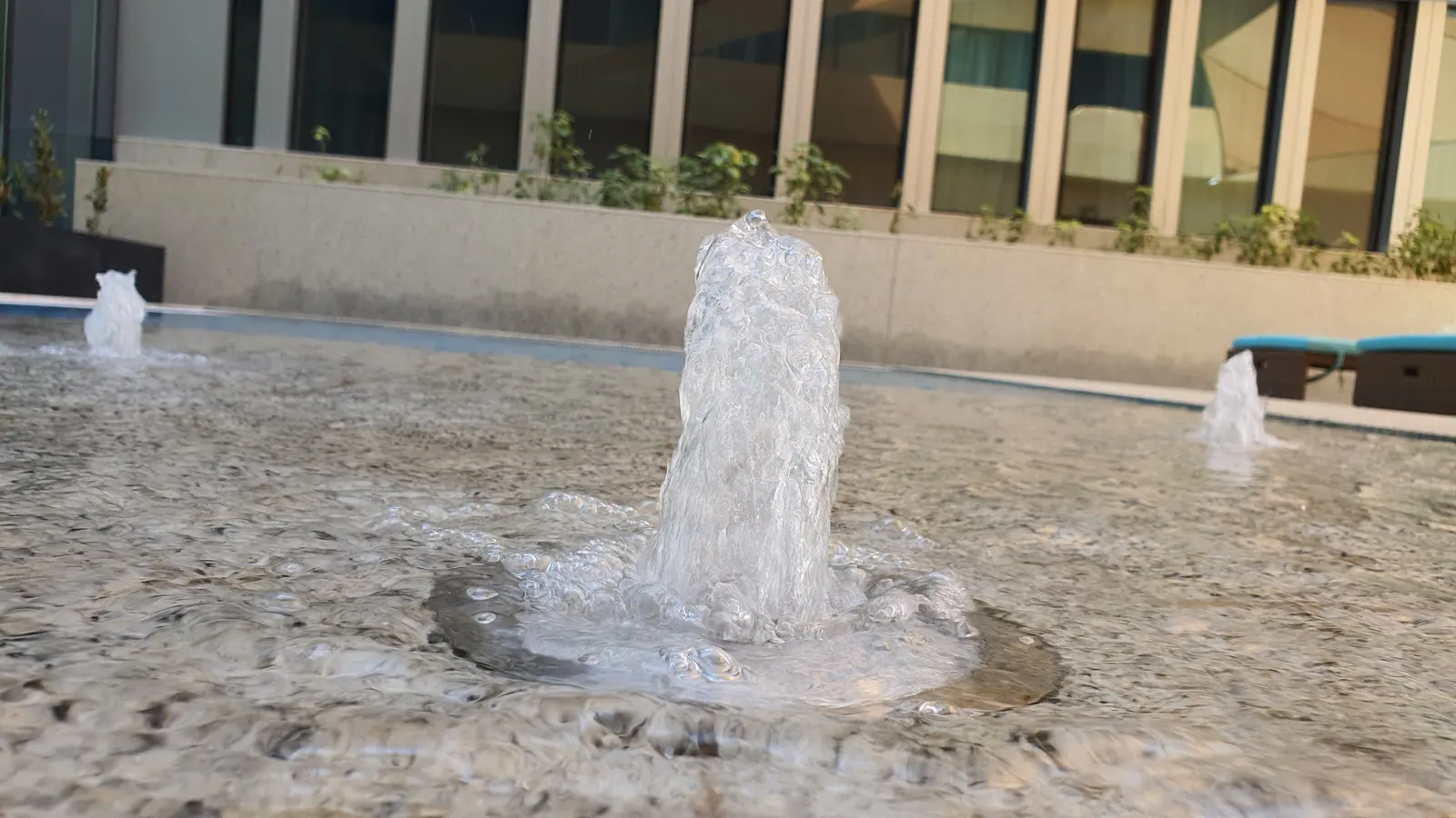 Bubbler fountain set in the paving