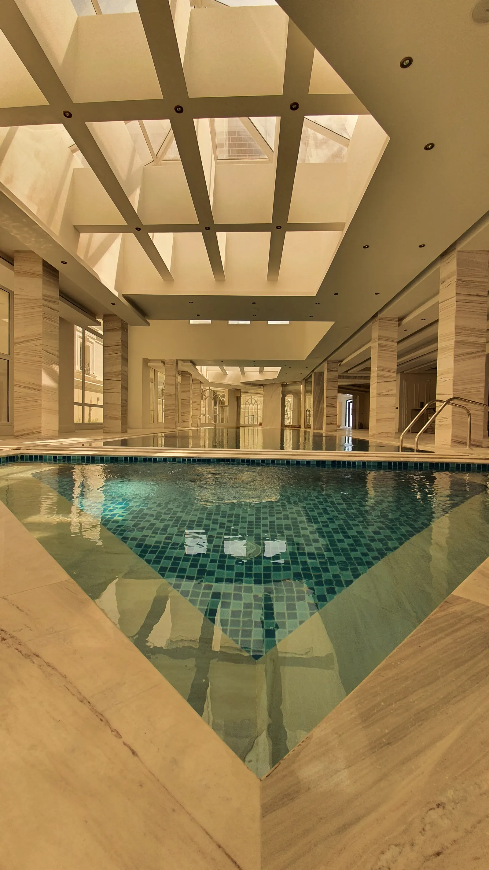 Indoor pool reflecting the glazed roof