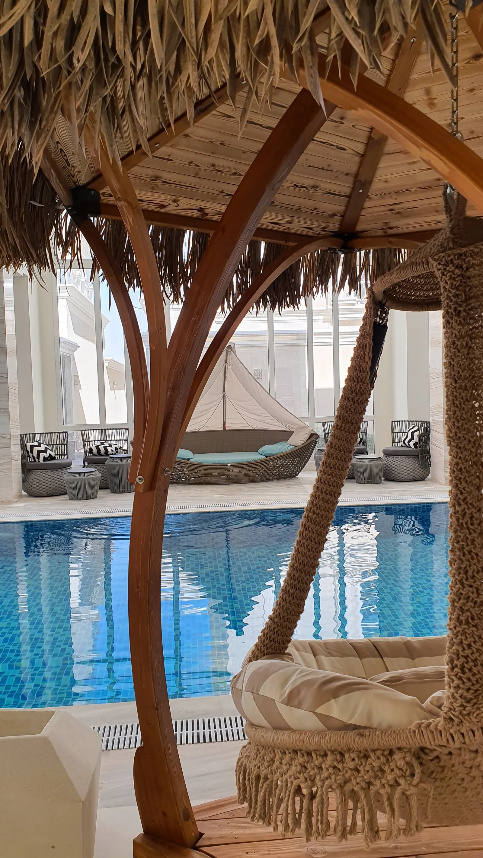 Pool edge beside the arched windows