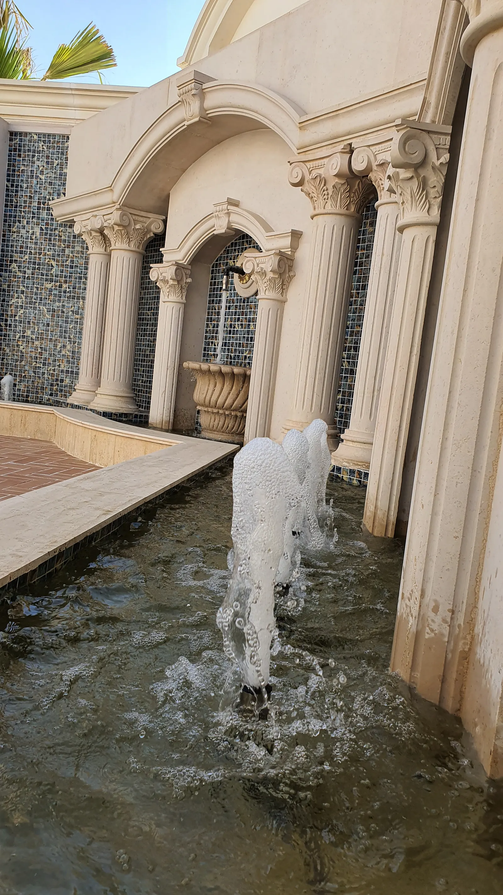 Courtyard fountain with classical columns