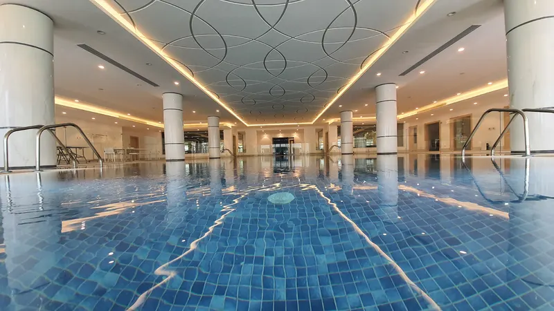 Indoor pool under a decorative ceiling